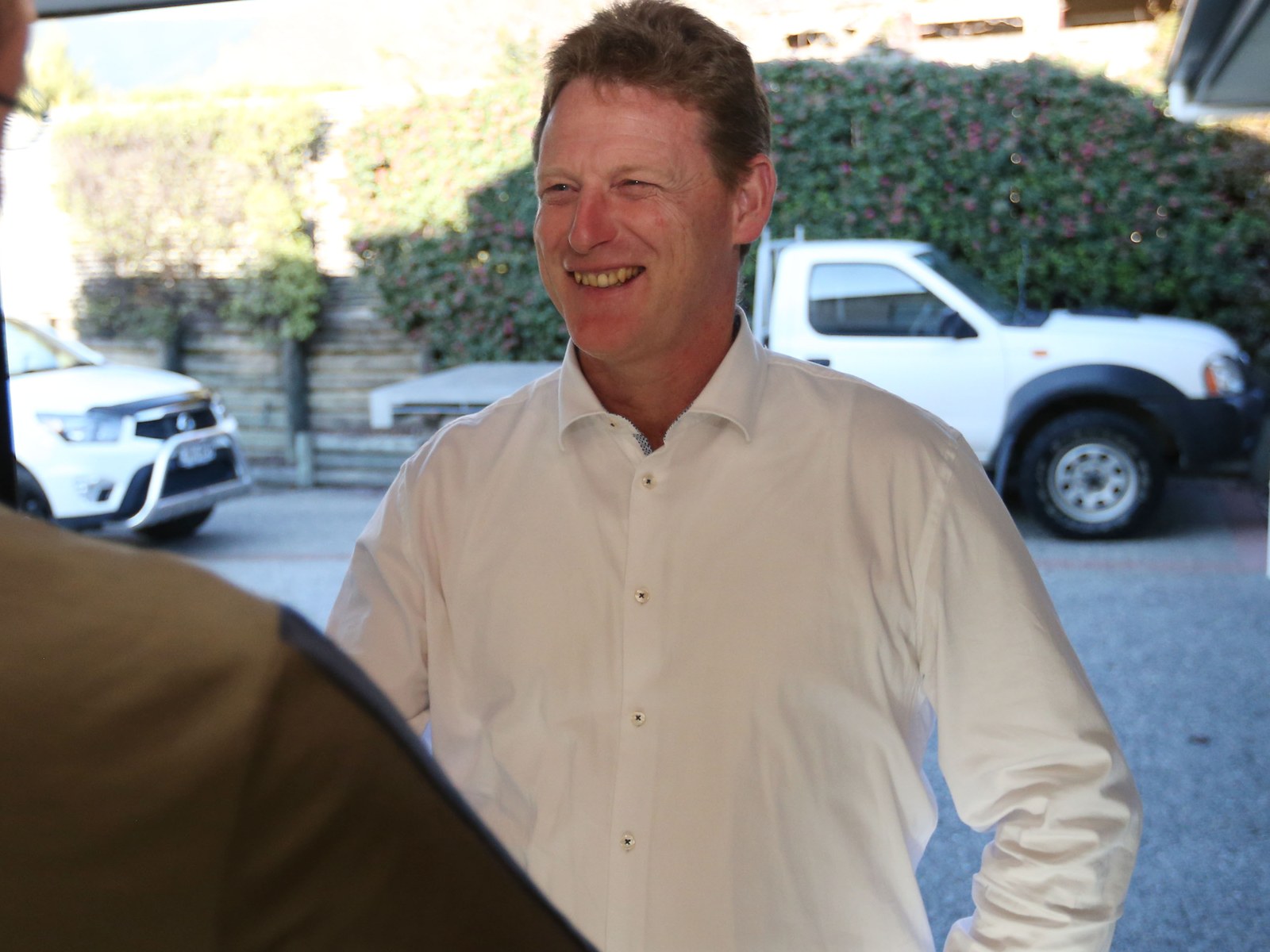 Dean McNamara meeting someone at a local home